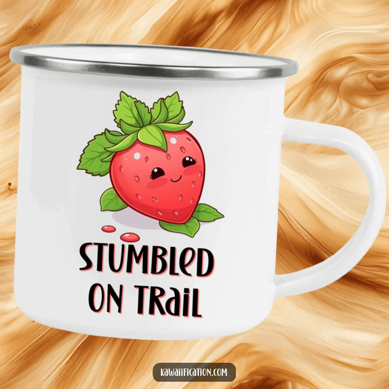 Funny Camping Mug showing a blushing strawberry tripping over its leaves, ideal for outdoor sweetness and humor.